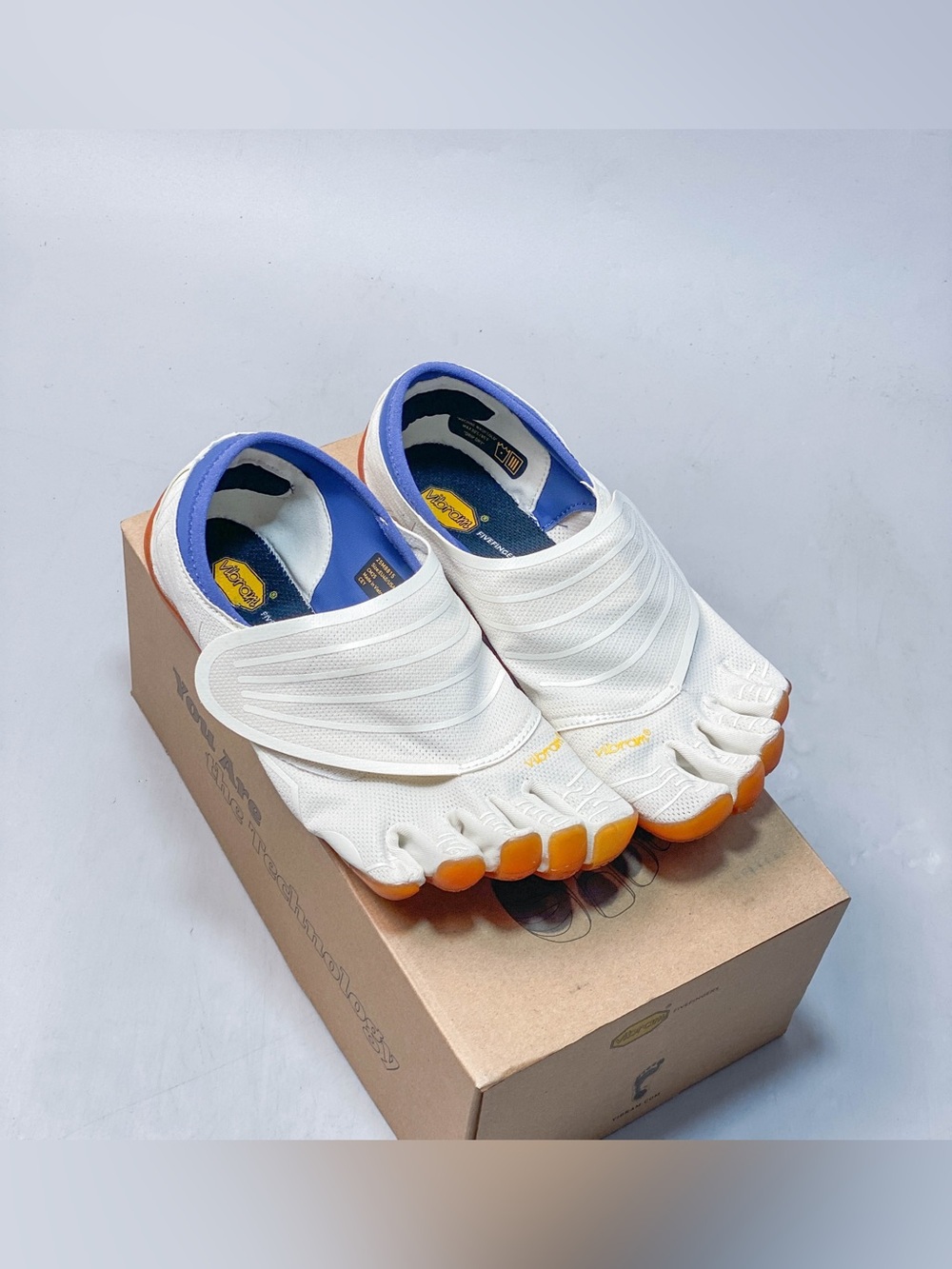 Vibram White Slip-On FiveFingers with Orange Sole and Blue Lining